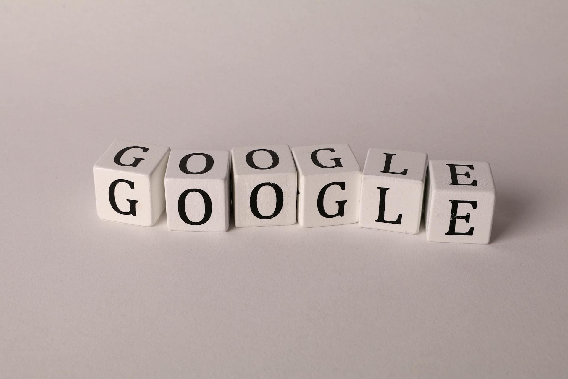 White blocks with letters spelling Google on a surface, symbolizing search and SEO concepts