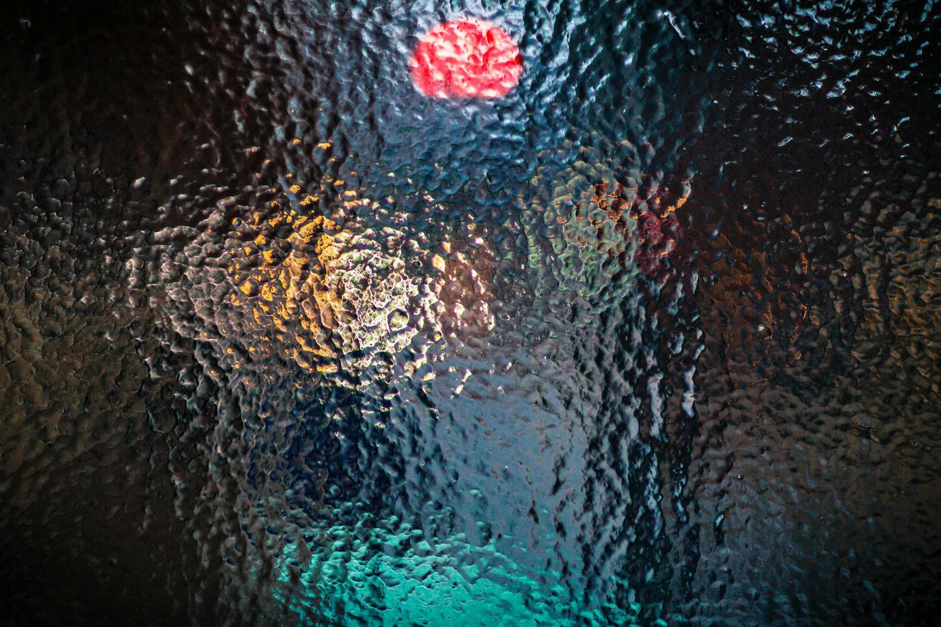 Vibrant abstract glass texture with defocused colorful light, illustrating glassmorphism and blur effects